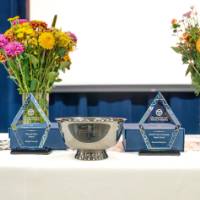 Table with awards and flowers